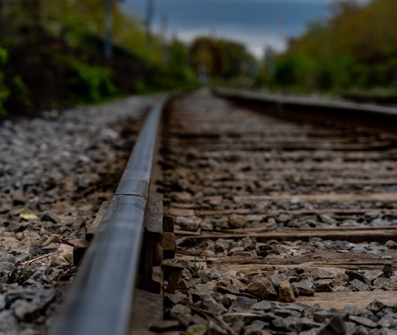 brown train rail during daytime